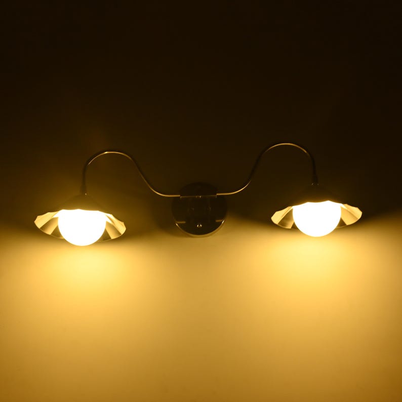 Modern bathroom vanity sconce with dual lights and polished chrome wall mount