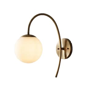 May include: A wall-mounted light fitting featuring a spherical, frosted glass shade. The fitting has a curved, brass-coloured arm and a circular mounting plate. The light is designed for wall mounting and provides ambient lighting.