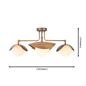 Mid Century Modern Brass Flush Mount With Four White Globe Lights And Sculptural Metal Leaf Shades