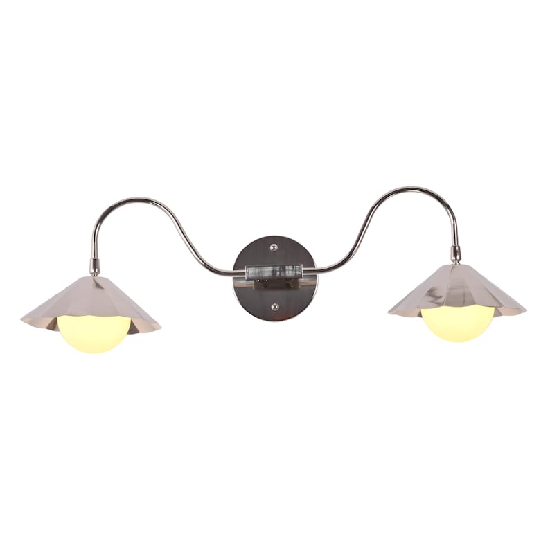 Contemporary chrome vanity light with curved silhouette and two glowing globe bulbs