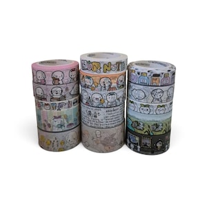 May include: Three stacks of decorative washi tape rolls featuring various cartoon character illustrations, colorful patterns, and text including "SUN NOTE" and "sticker". The rolls display diverse themes like bottles, nature, and daily activities.