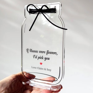 May include: Clear acrylic mason jar with a black ribbon and the text "If Nanas were flowers, I'd pick you" with a red heart and "Love Claire & Issy".