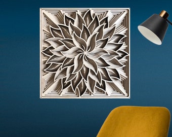 May include: A square, layered wooden wall art piece featuring a floral design. The artwork uses shades of brown, gray, and white to create a dimensional effect. The piece is mounted on a dark blue wall, with a yellow chair and black lamp in the background.