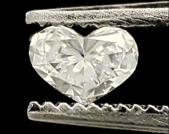 0.15 Carat Natural Heart-shaped Diamond VVS-VS clarity F-G Color in a silver prong setting