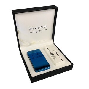 May include: A blue electric arc cigarette lighter in a black gift box with a USB charging cable. The box has the text "Arc cigarette lighter" printed on the inside.