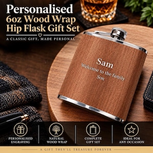 May include: A 6oz hip flask featuring a wood wrap finish and a silver-toned metal cap. The front of the flask is engraved with the text Sam, Welcome to the family, Son. The flask has a rectangular shape with rounded corners and a metallic rim.
