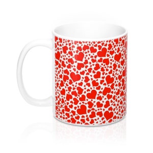 May include: White ceramic mug with a handle, covered in a pattern of red hearts of varying sizes. The hearts are scattered across the surface of the mug, creating a romantic and cheerful design. The mug is suitable for hot or cold beverages.