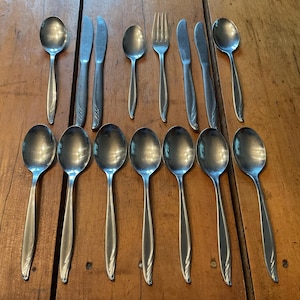 May include: A rustic wooden sign with the text "Welcome to our home" in white lettering. The sign features a distressed finish and a simple, inviting design, perfect for a front porch or entryway.