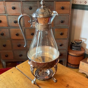 May include: A rustic wooden sign with the text "Welcome to our home" in white lettering. The sign features a distressed finish and a simple, inviting design, perfect for front door decor.