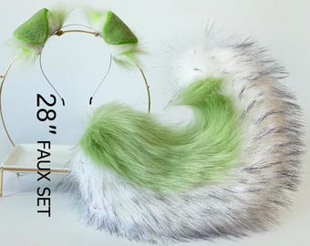 May include: A green and white faux fur tail with a matching headband. The tail is 28 inches long and is attached to a gold headband. The tail is made of soft, fluffy fur and is perfect for adding a touch of whimsy to any outfit.