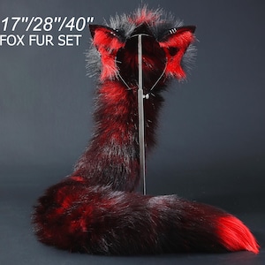 May include: A red and black fox fur tail with matching earmuffs. The tail is 17 inches, 28 inches, or 40 inches long.  The set is called "Fox Fur Set".