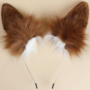 May include: Brown faux fur cat ears headband with a white fur trim. The headband is made of a thin metal wire and has black plastic ends.