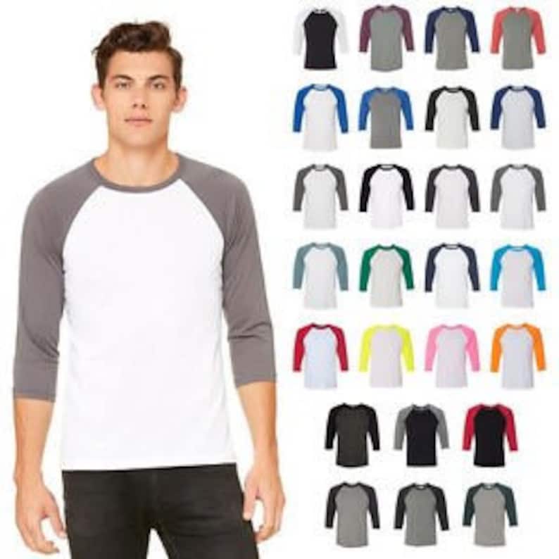 May include: A selection of 3/4 sleeve baseball t-shirts in various colour combinations. The shirts feature a contrasting colour on the sleeves and a white collar.