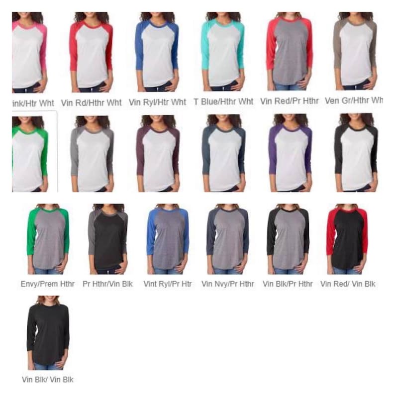 May include: A selection of baseball t-shirts in various colour combinations. The shirts feature a white base with coloured sleeves and a contrasting coloured collar. The colours include ink, red, royal blue, teal, grey, green, black, navy, and burgundy.