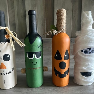 Hand painted Halloween themed wine bottles