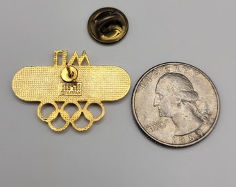 Pin's PRODIMPORT Panasonic - Jeux Olympiques - État Neuf