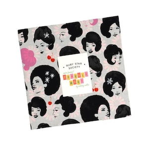 May include: A square stack of fabric squares featuring a repeating pattern of women with black bouffant hairstyles, pink flowers, and red cherries on a light grey background. A white label reads Ruby Star Society, super famous! Sparkle Mart.