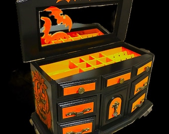 Vintage wooden jewelry cabinet with lovely details, in a spooky Halloween decor