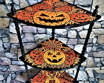Vintage wooden corner shelf, a gothic piece of furniture in black and orange with a spooky Halloween decor