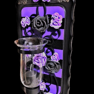 Wall decoration made of solid wood, with wrought iron candle holder in a magical design