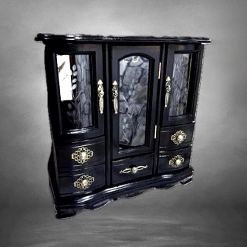 Large wooden jewelry cabinet, a vintage piece of furniture in black featuring beveled glass