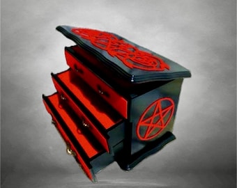 Gothic wooden jewelry cabinet, a vintage piece of furniture with red velvet