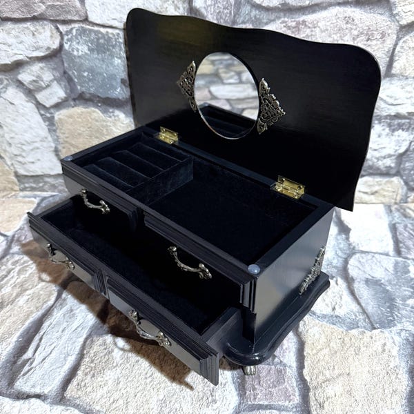 Small jewelry cabinet made of solid wood, a vintage piece of furniture with beautiful details in a new, elegant design