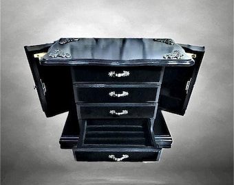 Wooden jewelry cabinet, a vintage piece of furniture in silky black