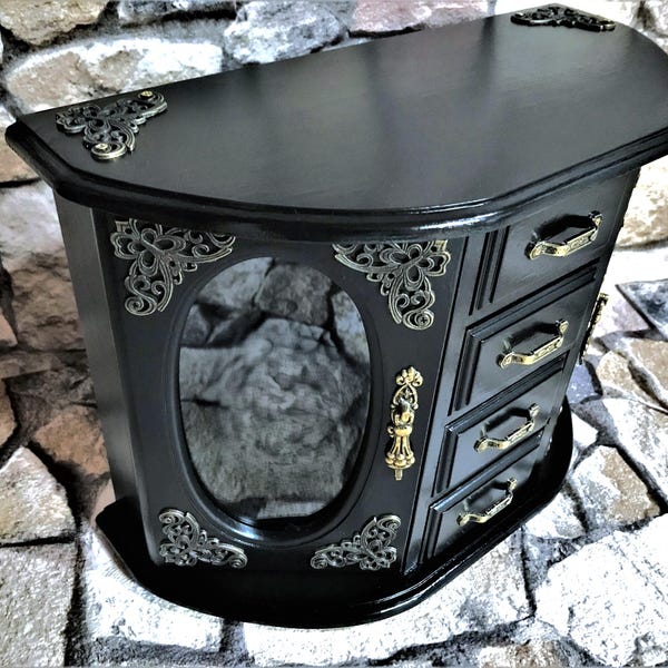 Special wooden jewelry cabinet, a vintage piece of furniture with fine glass inserts and an elegant design