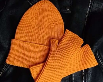 Women's knitted hat and gloves without fingers (mitts) of orange color from merino wool.