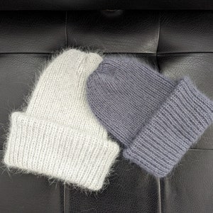 Light gray warm women&#39;s hat, fluffy women&#39;s hat, knitted wool hat, fashionable woolen hat.