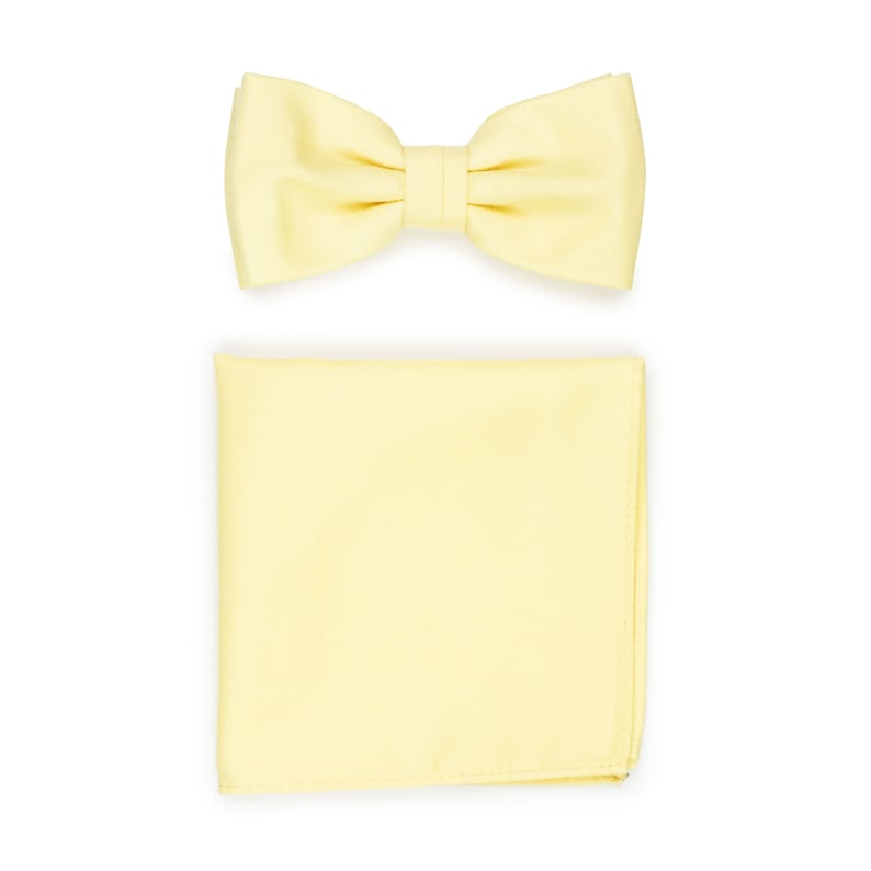 May include: A yellow bow tie and a yellow pocket square.