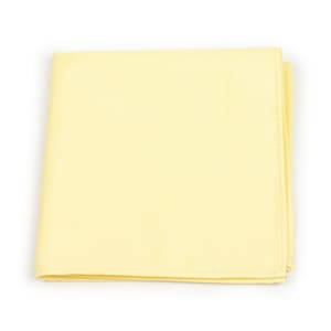 May include: A pale yellow fabric handkerchief, folded and lying flat on a white background.