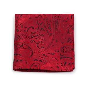May include: Red paisley pocket square with a black paisley pattern.