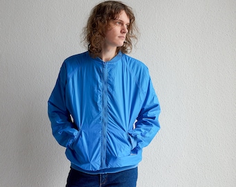 Jaqueta corta-vento vintage de nylon azul brilhante: jaqueta esportiva Paris