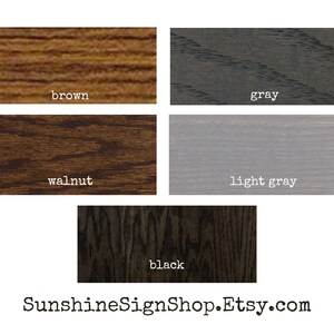 May include: A color palette featuring five wood stain samples: brown, gray, walnut, light gray, and black. Each sample is labeled with its respective color name in a white, sans-serif font. The website address Sunshinesignshop.Etsy.com is at the bottom.