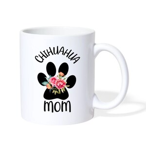 May include: White ceramic coffee mug with a black paw print with pink flowers and the text "Chihuahua Mom" in black.