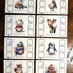 May include: Set of eight white cards with winter animal illustrations, including a fox, duck, bear, deer, owl, penguin, and squirrel. Each card has a grid of squares and snowflake designs. The text "Our Hometown Treasures" is printed on each card.