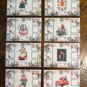 Könnte beinhalten: Eine Sammlung von acht Weihnachtskarten mit verschiedenen Illustrationen. Jede Karte zeigt ein anderes Design, darunter ein Rentier, ein Nussknacker, eine Schneekugel, ein Kardinal, der Weihnachtsmann, eine Weihnachtsmarke, ein Elf und ein roter Truck. Jede Karte hat einen dekorativen Rand und den Text "Our Hometown Treasures".