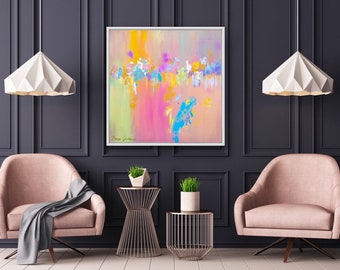 May include: Abstract painting in shades of pink, yellow, blue, and green. The painting is framed and hanging on a dark gray wall in a living room setting. Two pink armchairs and two gold side tables with plants are in the foreground.