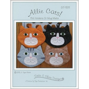 May include: A sewing pattern for four cat-shaped pot holders or mug mats. The pattern includes instructions for making orange, black, gray, and brown cat-shaped pot holders. The pattern is titled "Allie Cats!" and is by Susie C Shore Designs.