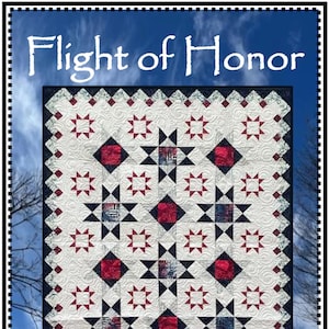 May include: A quilt with a white background featuring a repeating pattern of red squares, black stars, and blue accents. The quilt is framed with a black border and the text "Flight of Honor" and "Whirligig Designs" are displayed.
