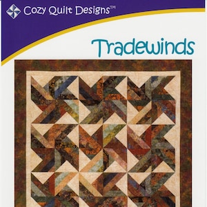 May include: A quilt pattern called "Tradewinds" designed by Georgette Dell'Orco. The pattern is for a quilt made with 2 1/2 inch strips and includes instructions for wall hanging, throw, twin, queen, and king sizes. The quilt features a geometric design with brown, tan, and green colors.