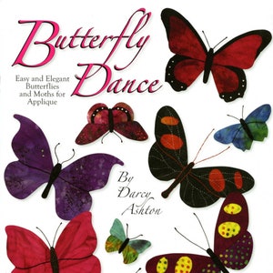 May include: A book cover with the title "Butterfly Dance" by Darcy Ashton. The cover features a colorful illustration of butterflies and moths in various poses.