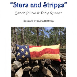 May include: A bench pillow and table runner with a patriotic theme. The design features the American flag with blue stars and red and white stripes. Finished size is 16 x 38 inches.