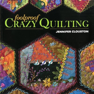 May include: A book titled "Foolproof Crazy Quilting" by Jennifer Clouston. The cover features a colorful patchwork quilt with various embroidery stitches and embellishments. The book includes a visual guide and 25 stitch maps for 100+ embroidery and embellishment stitches.