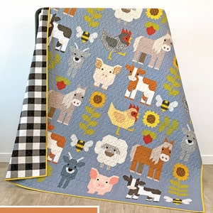 May include: A quilt pattern featuring a variety of farm animals, including cows, horses, pigs, chickens, goats, and sheep. The pattern also includes sunflowers and bees. The quilt is made in a patchwork style with a blue background and yellow accents. The text "FAB FARM" is printed at the bottom of the image.