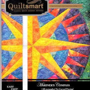 May include: A Quiltsmart printed interfacing package for a Mariner's Compass quilt pattern. The cover features a vibrant, multi-colored star design in shades of yellow, orange, blue, and purple, with text including Easy! Fast! Smart!