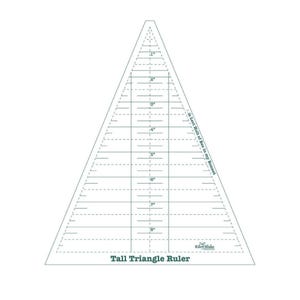May include: A clear plastic triangle ruler with markings in inches up to 8 inches. The ruler is labeled "Tall Triangle Ruler" and "10-Inch Half of The in my Bonnet".