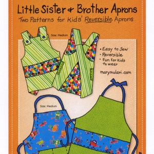 May include: Two sewing patterns for reversible aprons for kids. The patterns include a green and white striped apron with a colorful polka dot fabric on the reverse side and a blue apron with a robot print on the reverse side. The patterns are available in medium and small sizes.